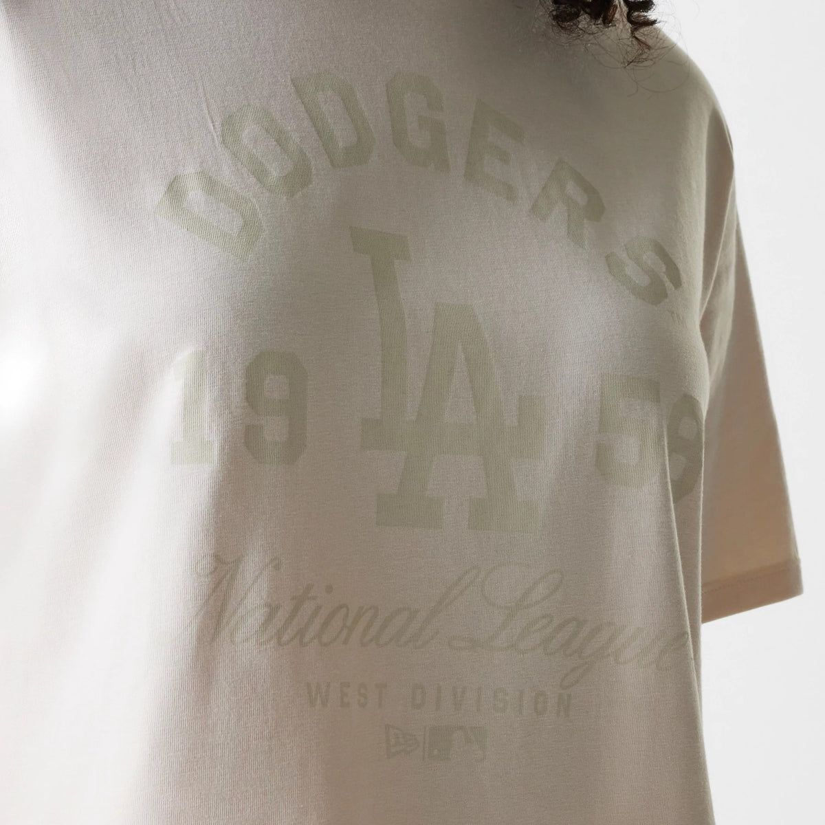 The Female model is wearing LA Dodgers Womens MLB Tonal Graphic Light Beige Oversized T-Shirt 4