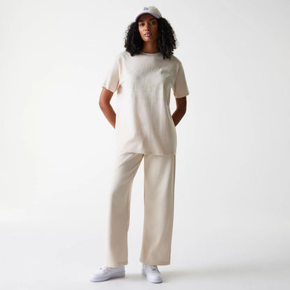 The Female model is wearing LA Dodgers Womens MLB Tonal Graphic Light Beige Oversized T-Shirt 8