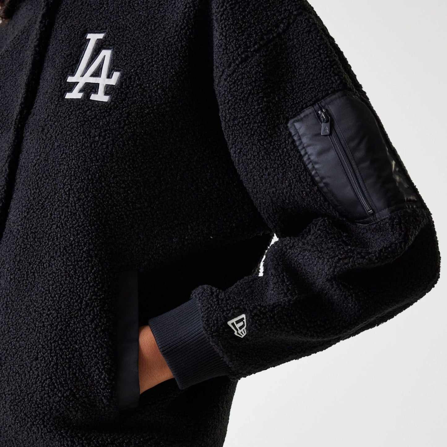 The Female model is wearing LA Dodgers Womens MLB Black Oversized Sherpa Bomber Jacket 4