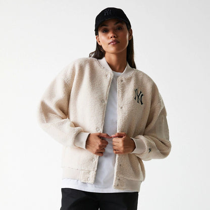 The Female model is wearing New York Yankees Womens MLB Light Beige Oversized Sherpa Bomber Jacket 3