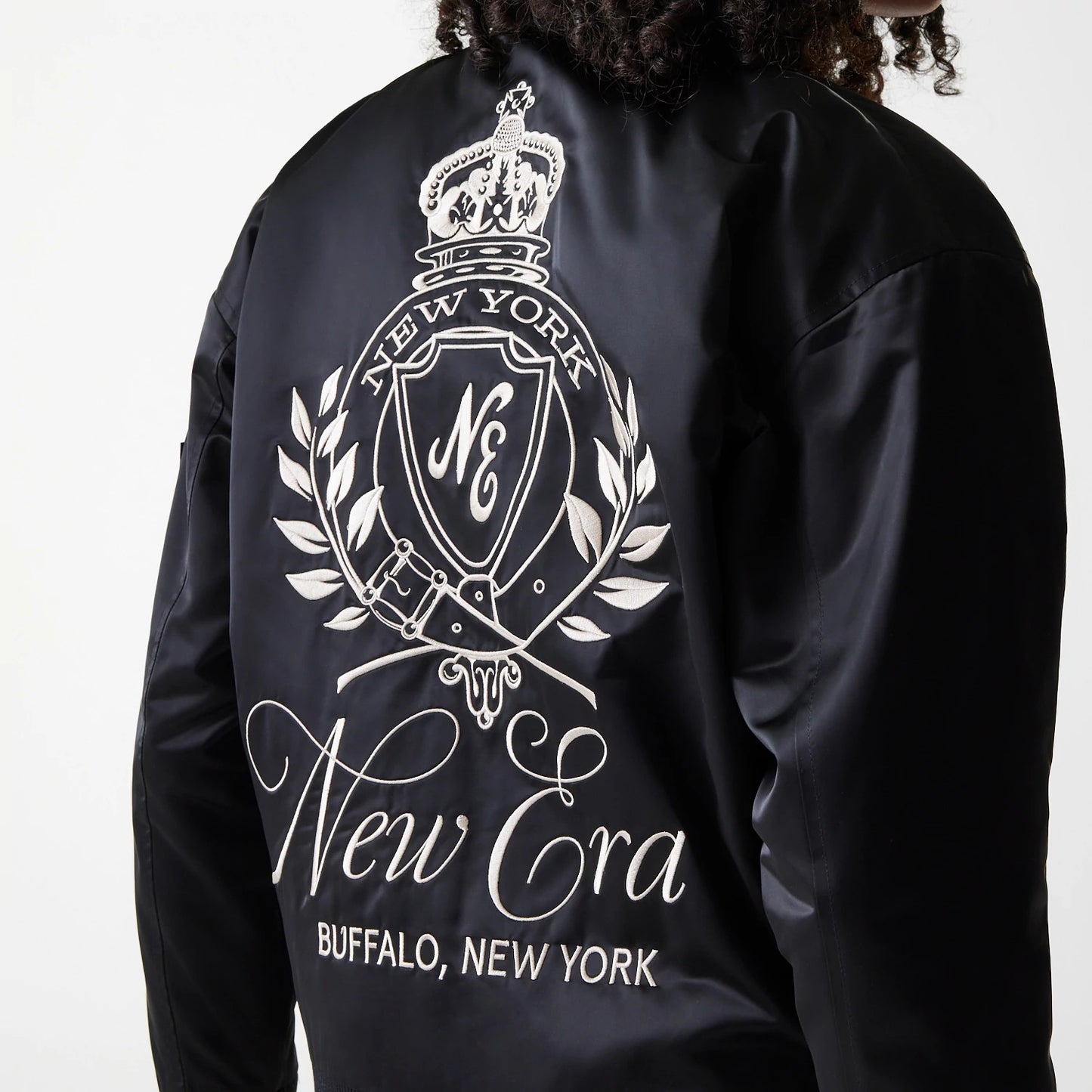 The Female model is wearing Womens New Era Satin Black Satin Bomber Jacket 4