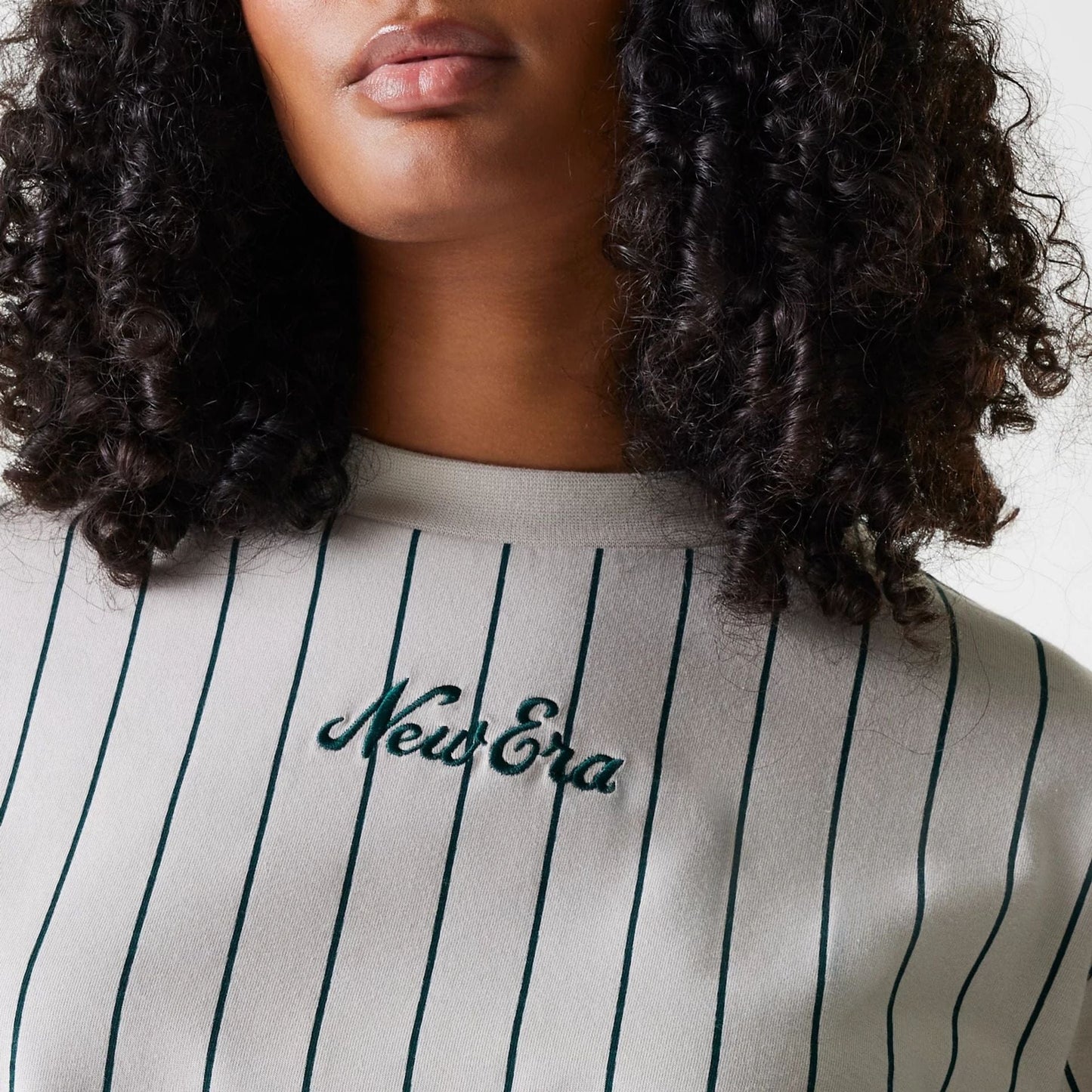 The Female model is wearing Womens New Era Pinstripe Light Beige Crop T-Shirt 4