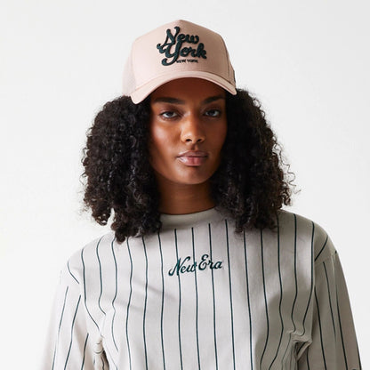 The Female model is wearing Womens New Era Pinstripe Light Beige Crop T-Shirt 5