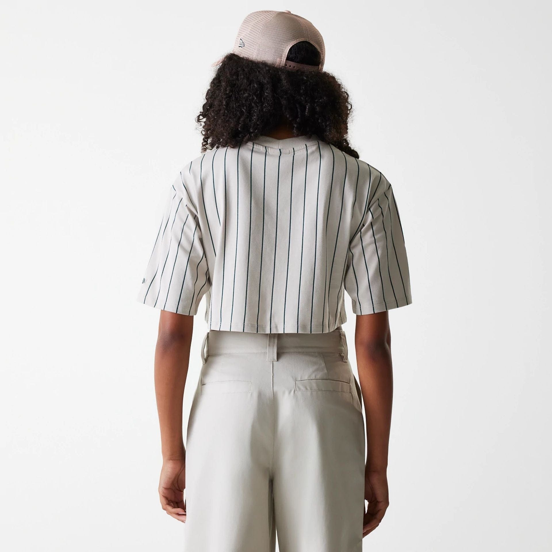 The Female model is wearing Womens New Era Pinstripe Light Beige Crop T-Shirt 2