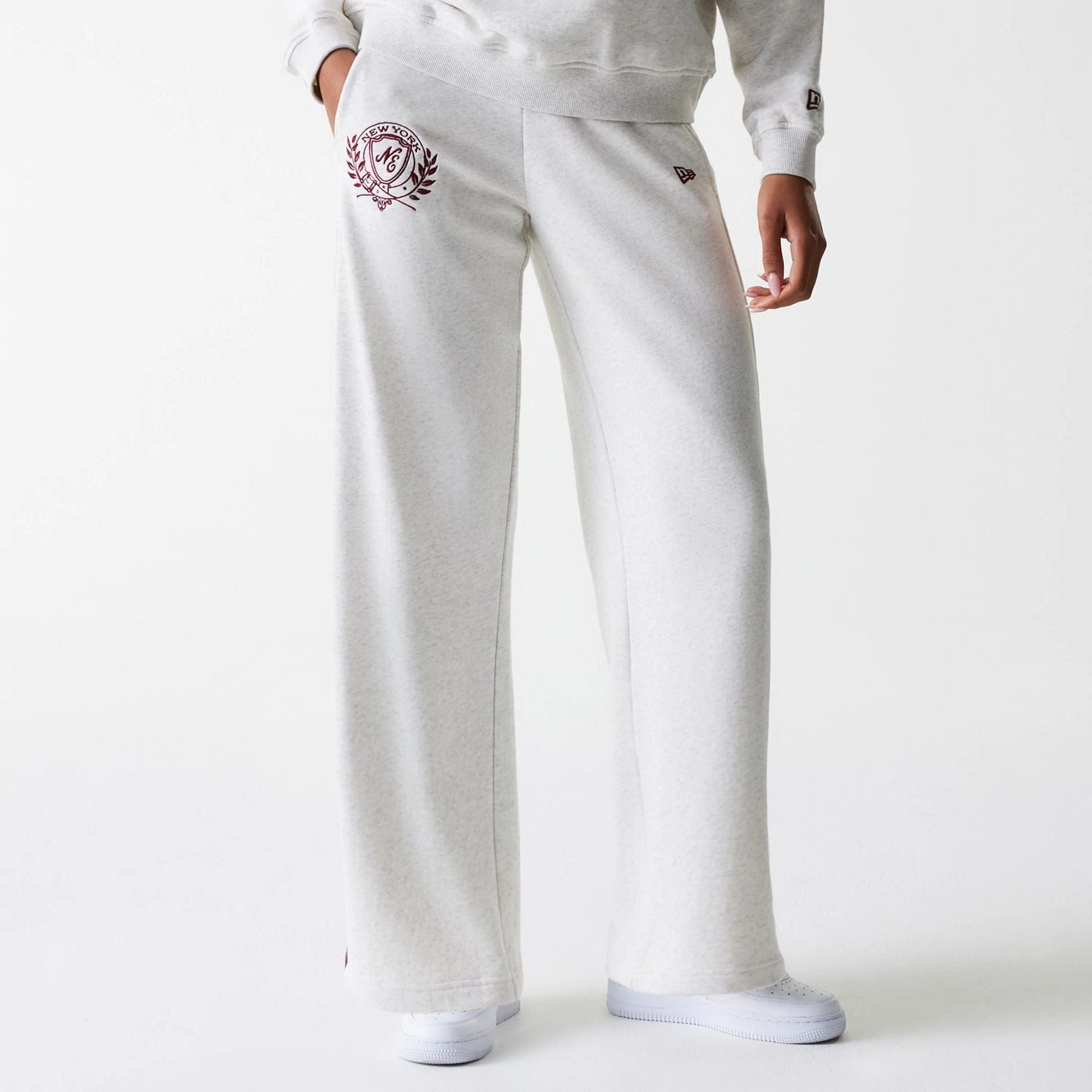 The Female model is wearing Womens New Era Pastel Grey Straight Leg Joggers 1