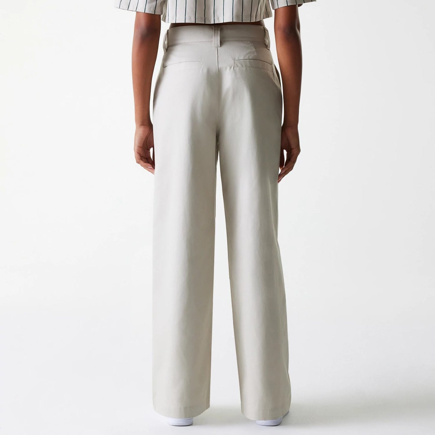 The Female model is wearing Womens New Era Light Beige Wide Leg Chino Trousers 2