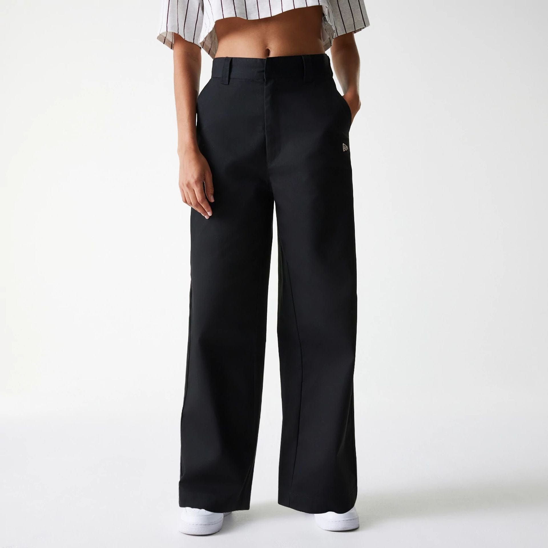 The Female model is wearing Womens New Era Black Wide Leg Chino Trousers 1