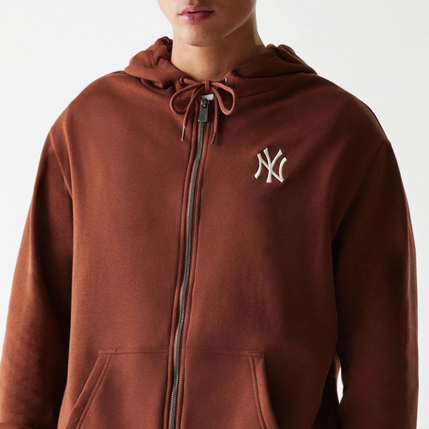 The Male model is wearing New York Yankees MLB Midi League Essential Brown Oversized Full Zip Hoodie 6