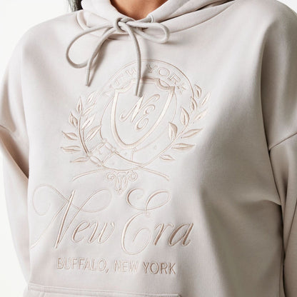 The Female model is wearing Womens New Era Crest Light Beige Pullover Hoodie 6