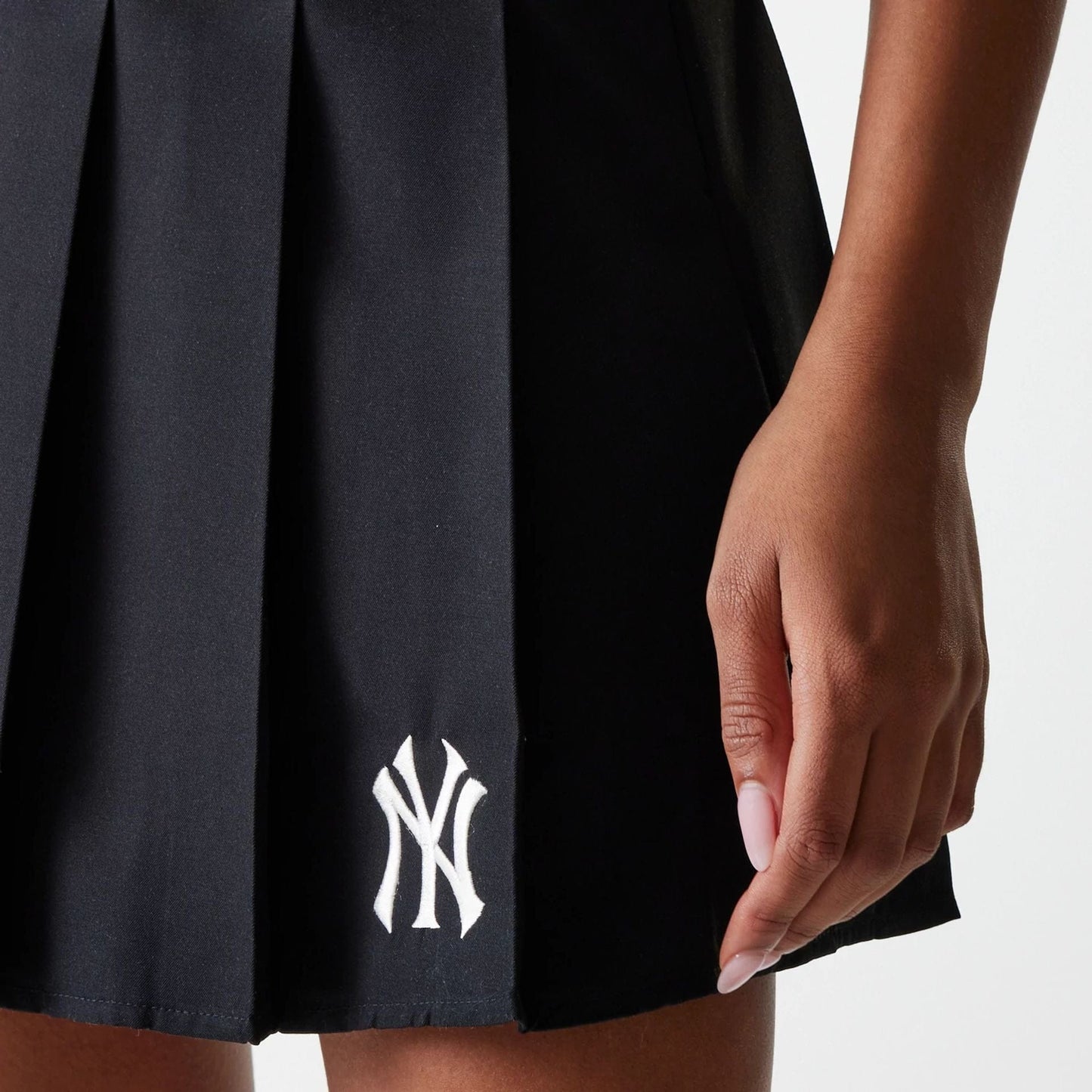 The Female model is wearing New York Yankees Womens MLB Black Tennis Skirt 4