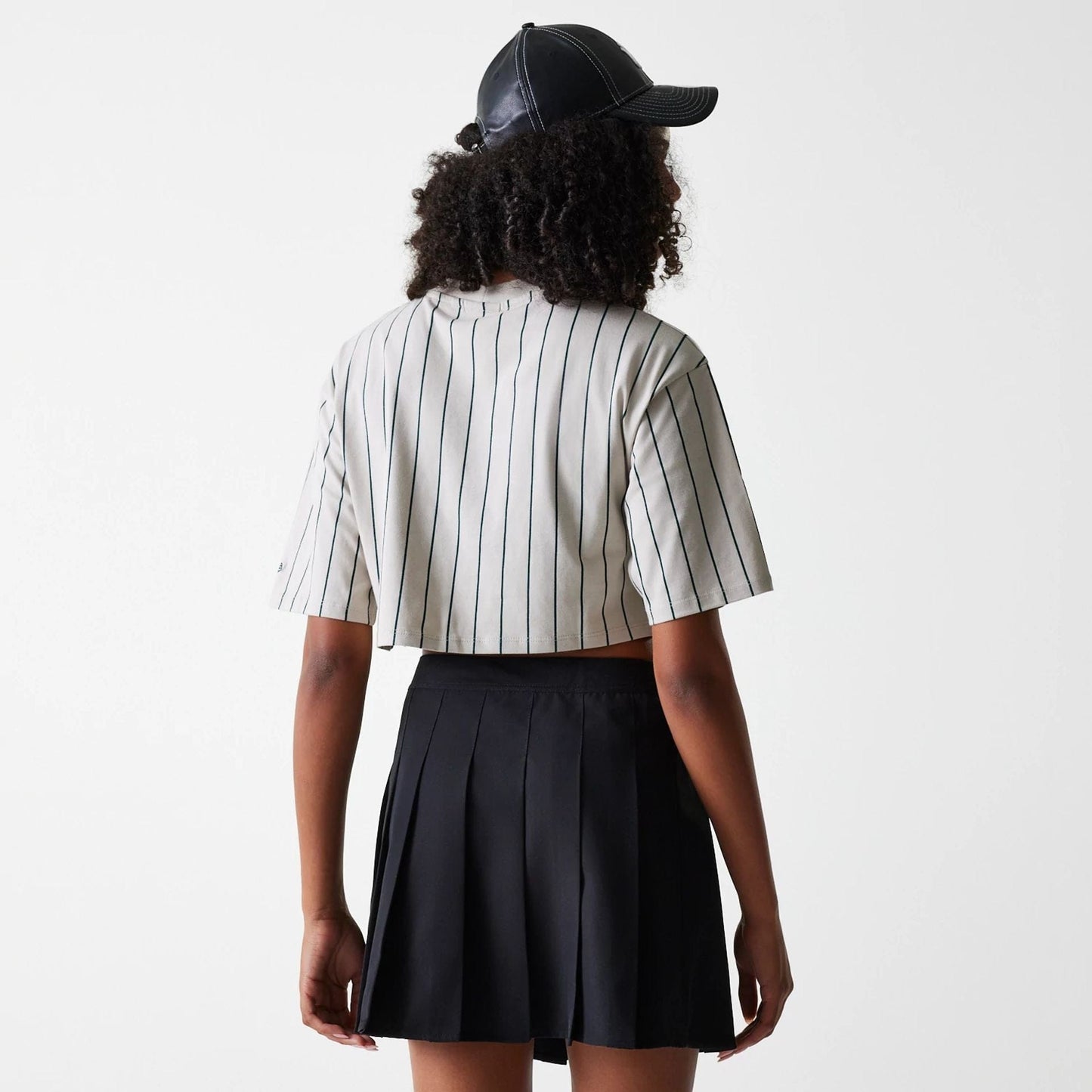 The Female model is wearing New York Yankees Womens MLB Black Tennis Skirt 2