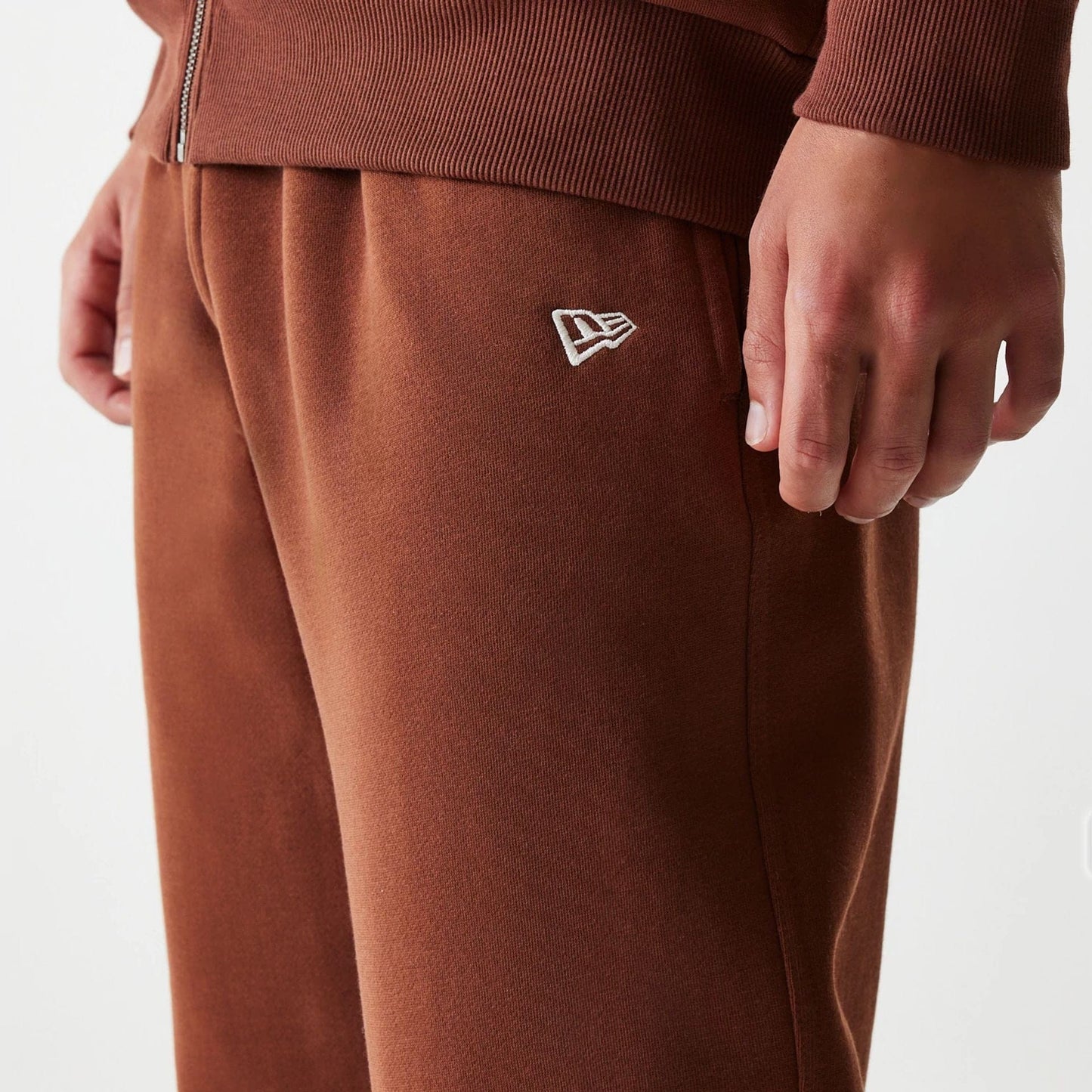 The Male model is wearing New York Yankees MLB Midi League Essential Brown Joggers 5