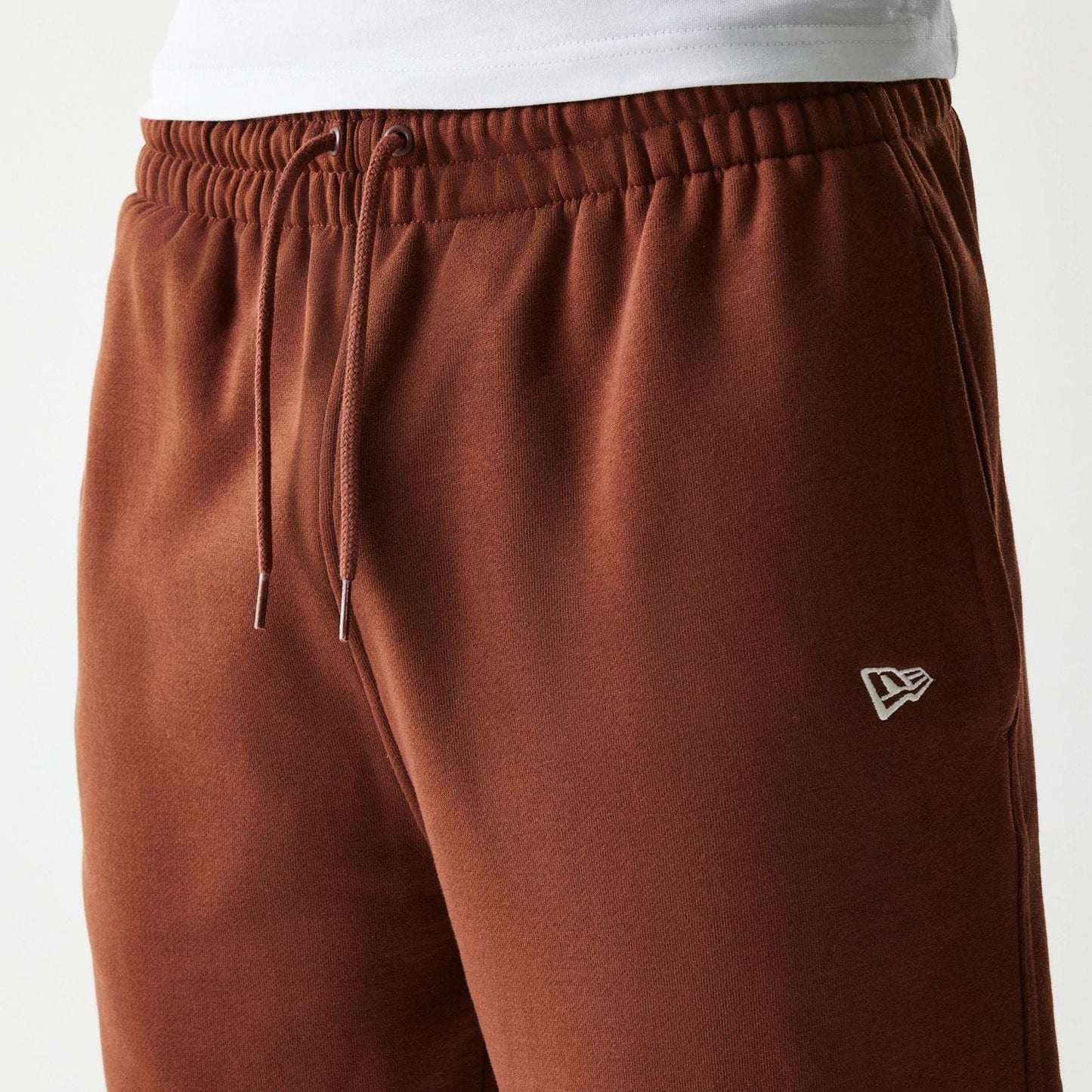 The Male model is wearing New York Yankees MLB Midi League Essential Brown Joggers 4