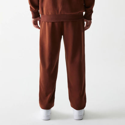 The Male model is wearing New York Yankees MLB Midi League Essential Brown Joggers 2