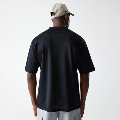 The Male model is wearing Las Vegas Raiders NFL Essentials Black Oversized Mesh T-Shirt 2