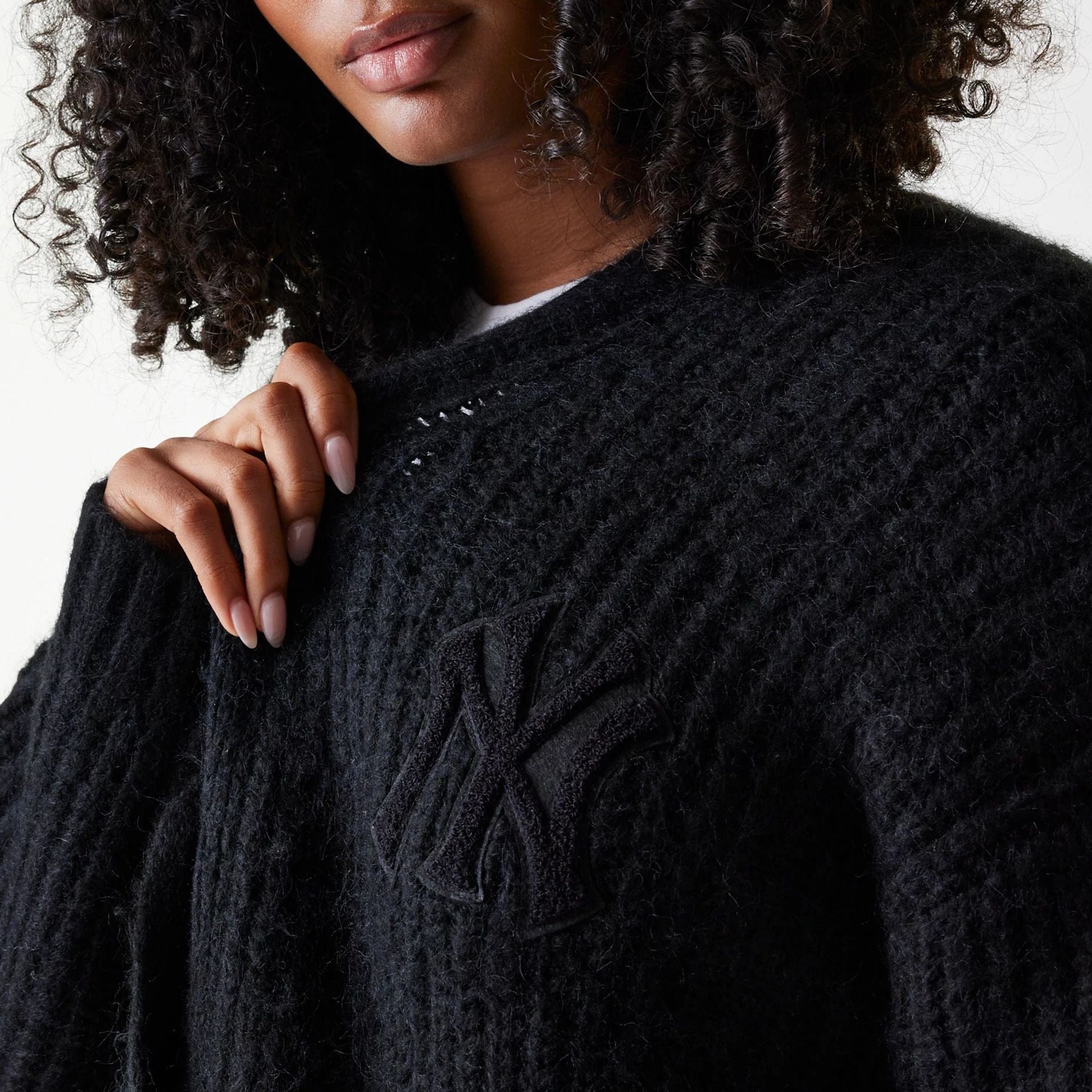 The Female model is wearing New York Yankees Womens MLB Knit Black Cardigan 4