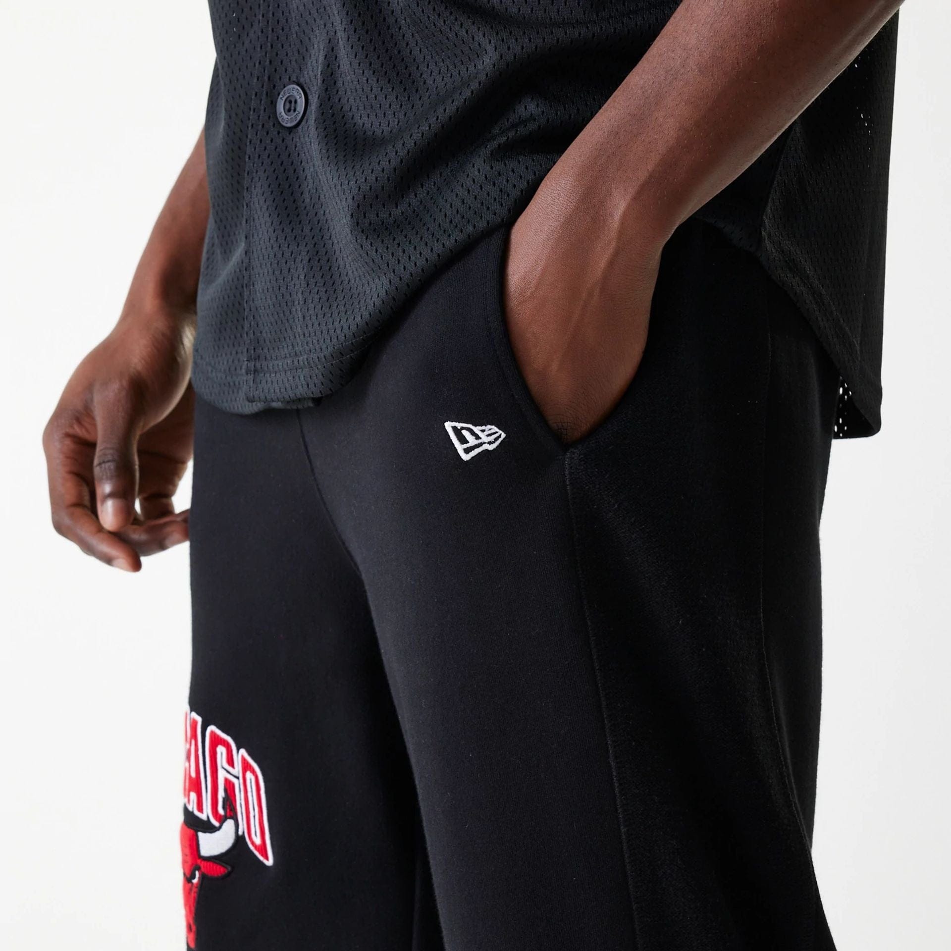 The Male model is wearing Chicago Bulls NBA Arch Graphic Black Joggers 5