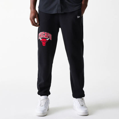 The Male model is wearing Chicago Bulls NBA Arch Graphic Black Joggers 1