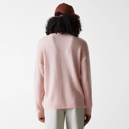 The Female model is wearing New York Yankees Womens MLB Knit Pastel Pink Crew Neck Sweater 2