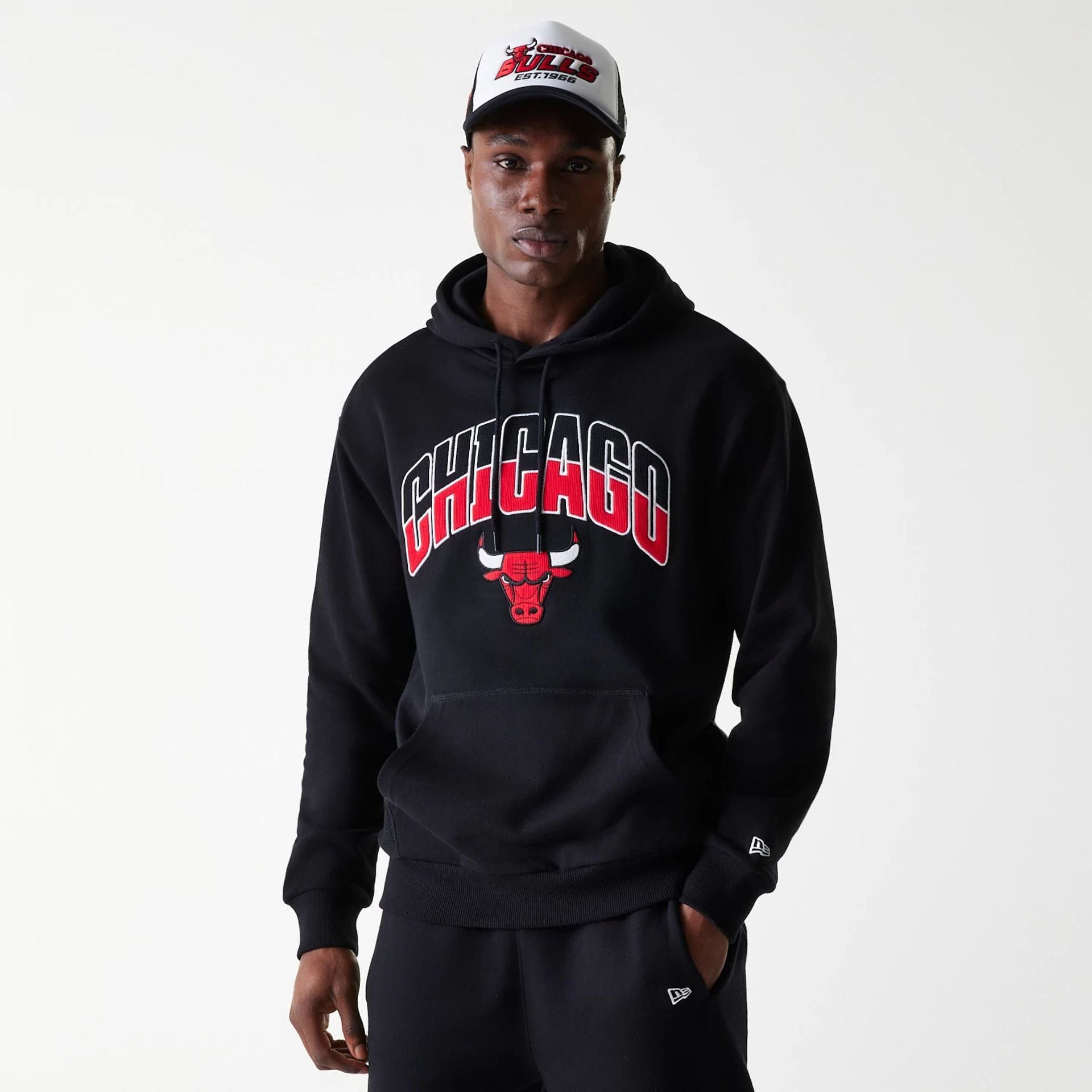 The Male model is wearing Chicago Bulls NBA Arch Graphic Black Oversized Pullover Hoodie 1