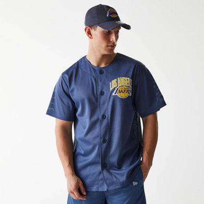 The Male model is wearing LA Lakers NBA Arch Graphic Dark Blue Mesh Jersey 1