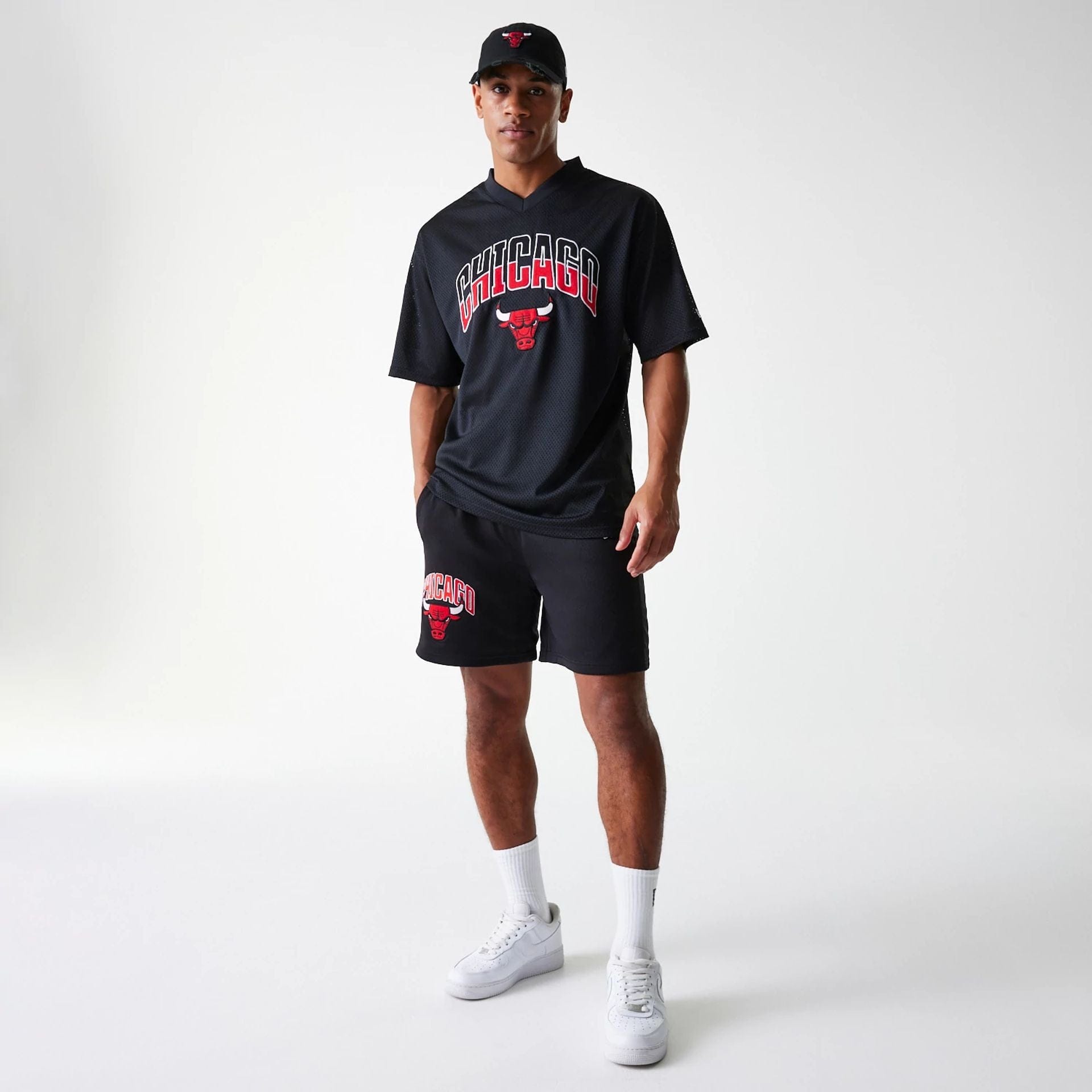 The Male model is wearing Chicago Bulls NBA Arch Graphic Black Mesh Shorts 8