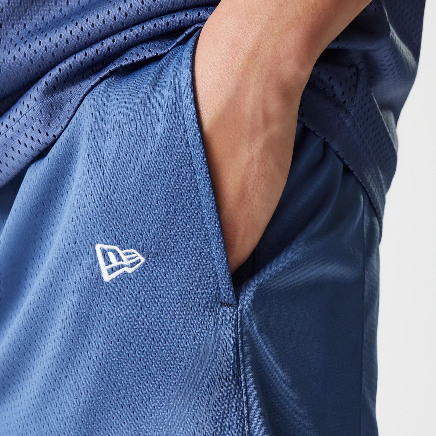 The Male model is wearing LA Lakers NBA Arch Graphic Dark Blue Mesh Shorts 4