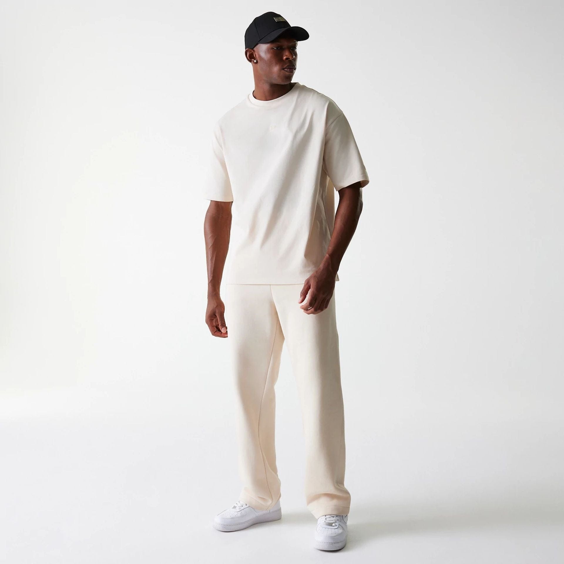 The Male model is wearing New Era Light Beige Straight Leg Joggers 3
