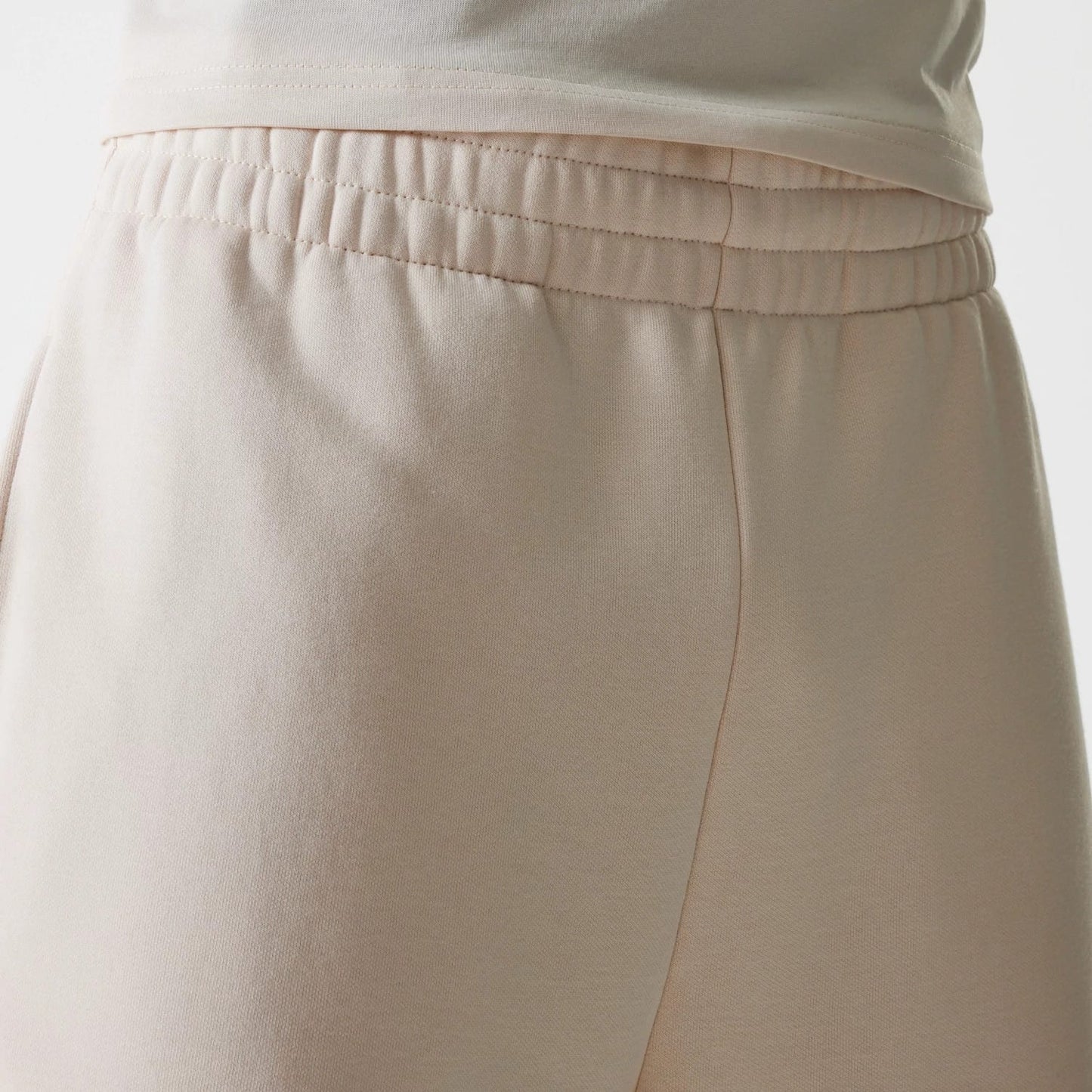 The Male model is wearing New Era Light Beige Straight Leg Joggers 5