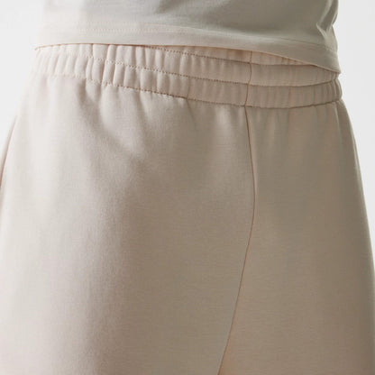 The Male model is wearing New Era Light Beige Straight Leg Joggers 5