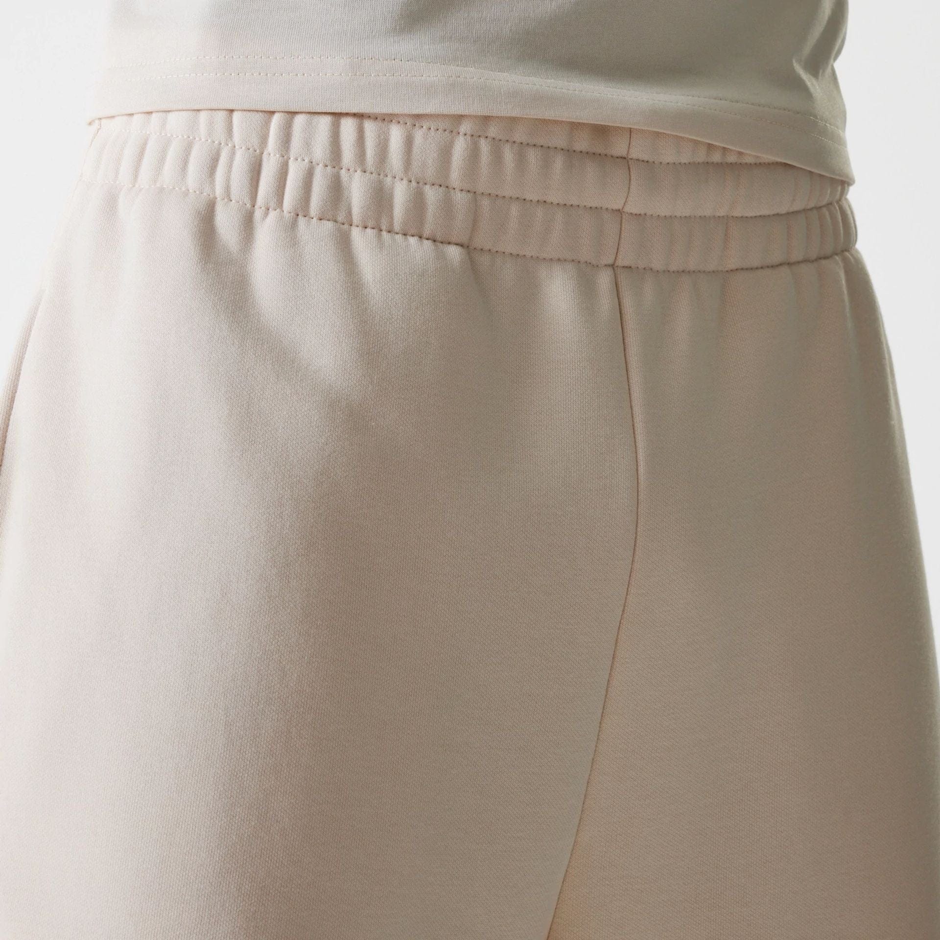 The Male model is wearing New Era Light Beige Straight Leg Joggers 5