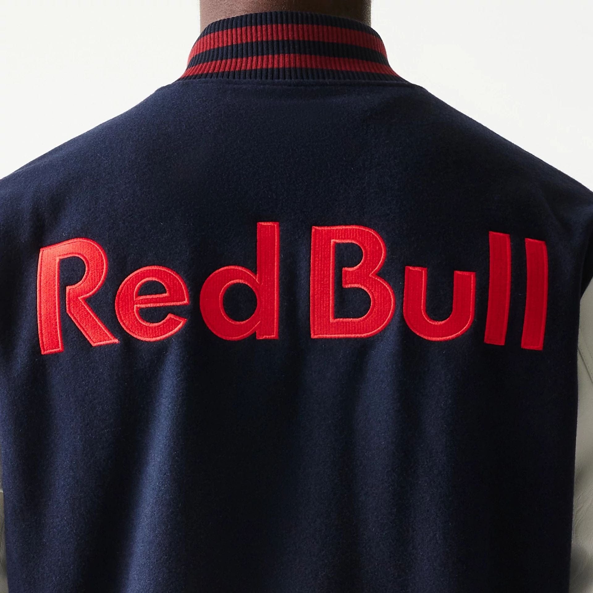 The Male model is wearing Red Bull Racing Dark Blue Varsity Jacket 5
