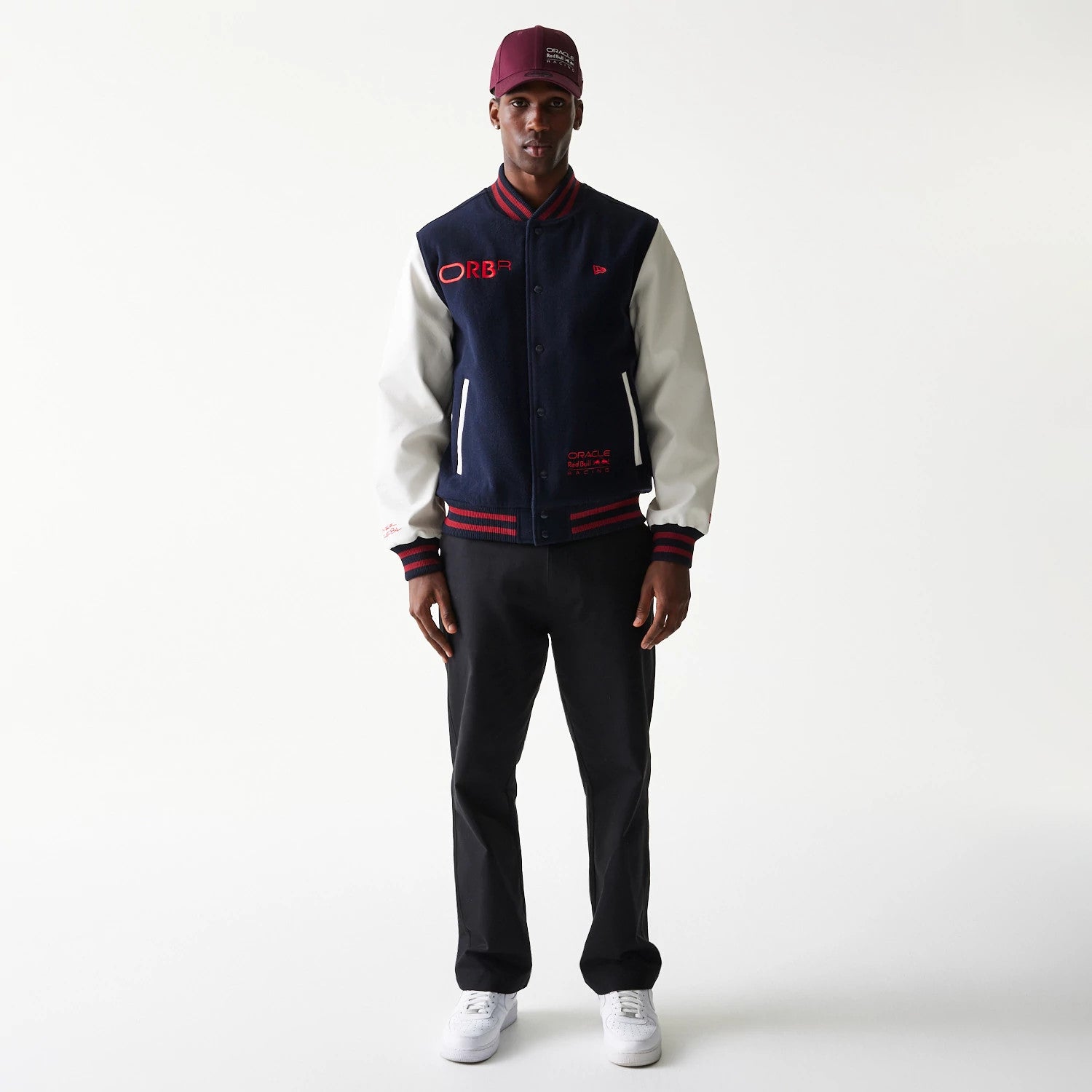 The Male model is wearing Red Bull Racing Dark Blue Varsity Jacket 7