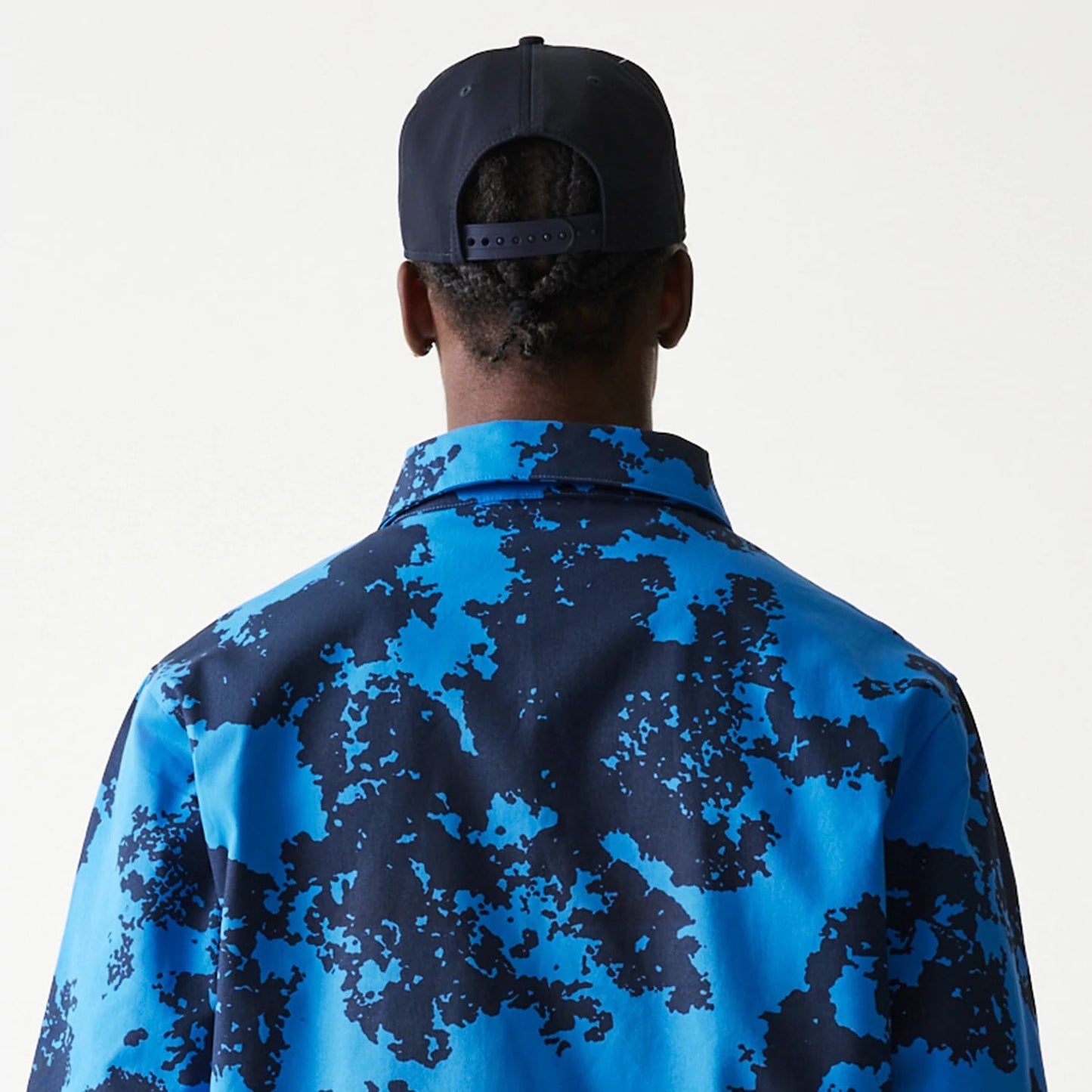 The Male model is wearing Red Bull Racing Blue Oversized Coaches Jacket 7