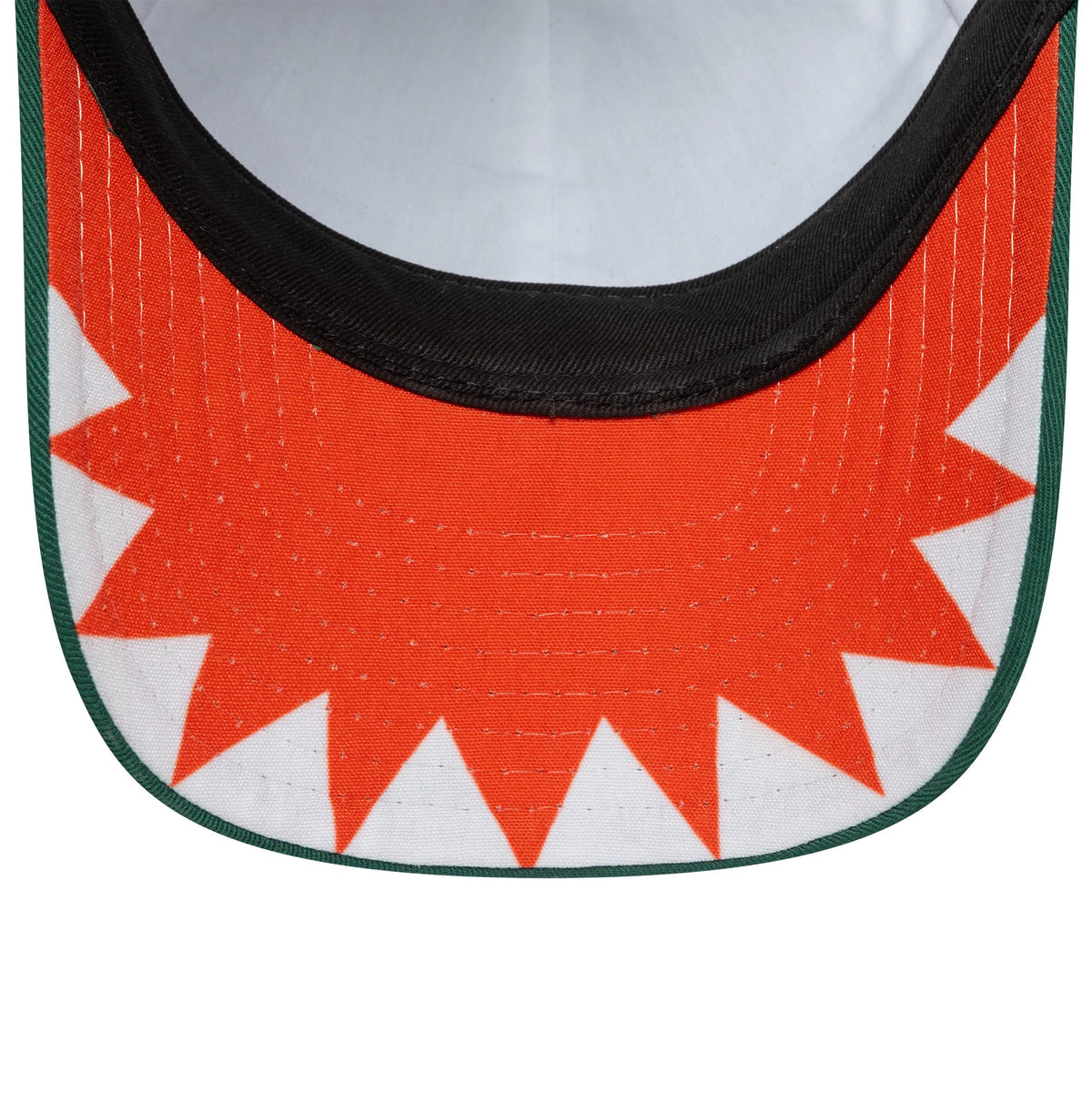 Child New Era Face Green 9FORTY Adjustable Cap, inside view showing a bright orange and white pattern on the underside of the visor, with black taping along the edge against a white sweatband.