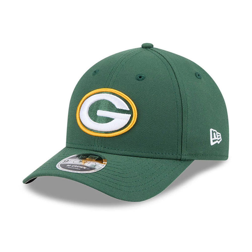 Green Bay Packers NFL Team Dark Green New Era 9FORTY M-Crown Cap, three-quarter view showing the green raised embroidered G logo with gold outline on the front panel, curved visor and 9FORTY size sticker.