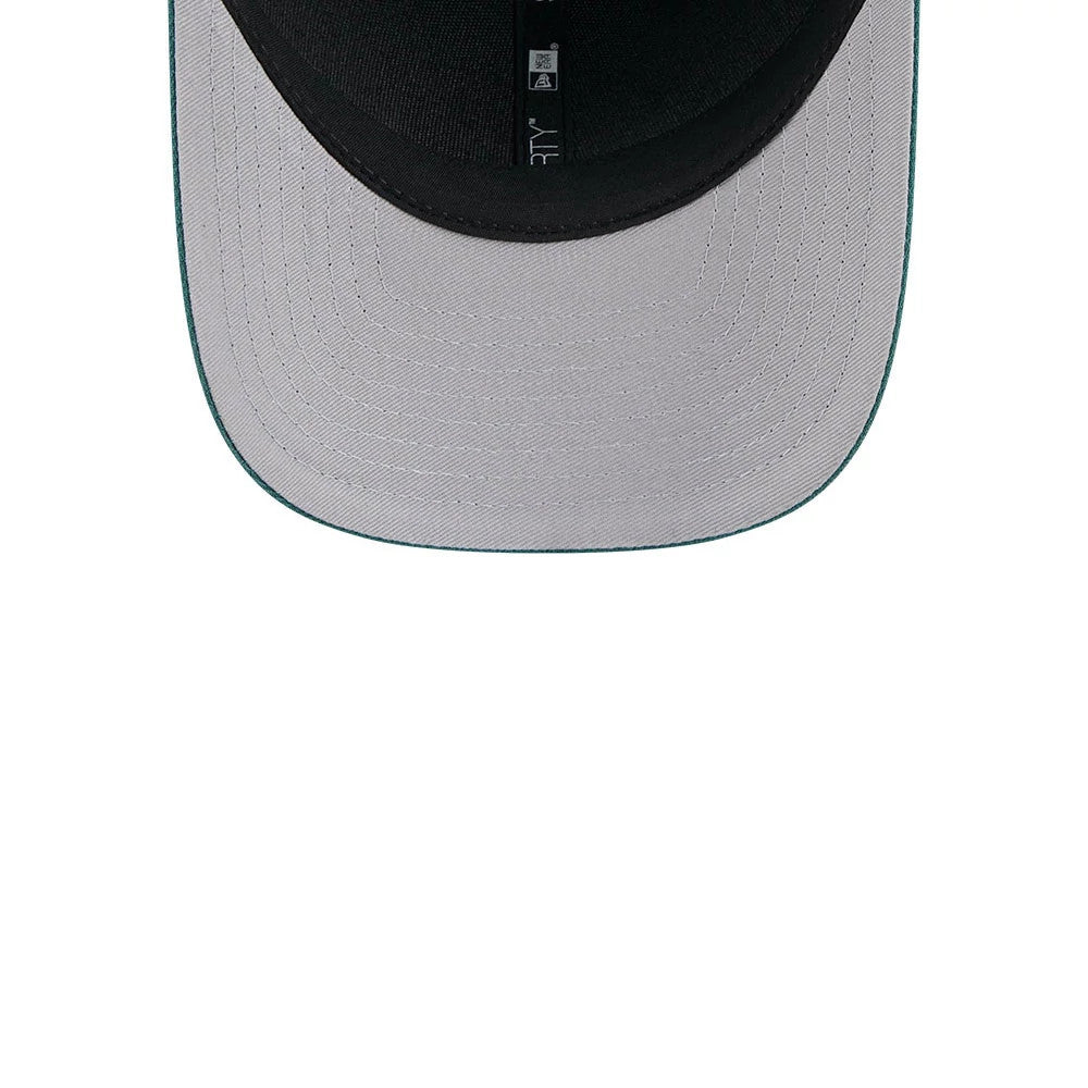 Philadelphia Eagles NFL Team Dark Green New Era 9FORTY M-Crown Cap, inside view showing black sweatband and taping with a grey undervisor, showcasing meticulous stitching detail across the underside of the visor.