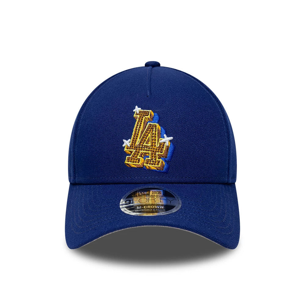 LA Dodgers MLB Emblem Dark Blue New Era 9FORTY M-Crown A-Frame Adjustable Cap, front view showing a large gold and white embroidered LA logo on the structured crown, with a 9FORTY size sticker on the curved visor.