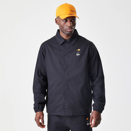 Slide 12:The Male model is wearing McLaren Racing McLaren Black Coaches Jacket 1
