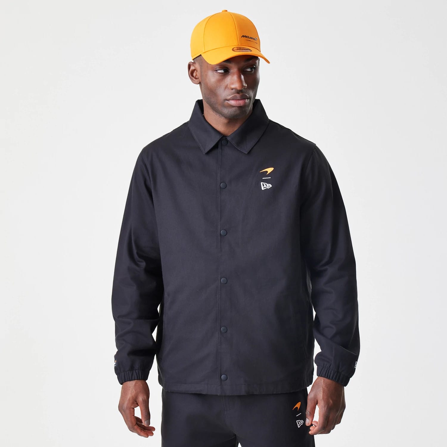 The Male model is wearing McLaren Racing McLaren Black Coaches Jacket 1