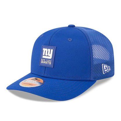 This is a New York Giants NFL Sideline 2025 Dark Blue 9SEVENTY Trucker Stretch Snap Adjustable Cap 1