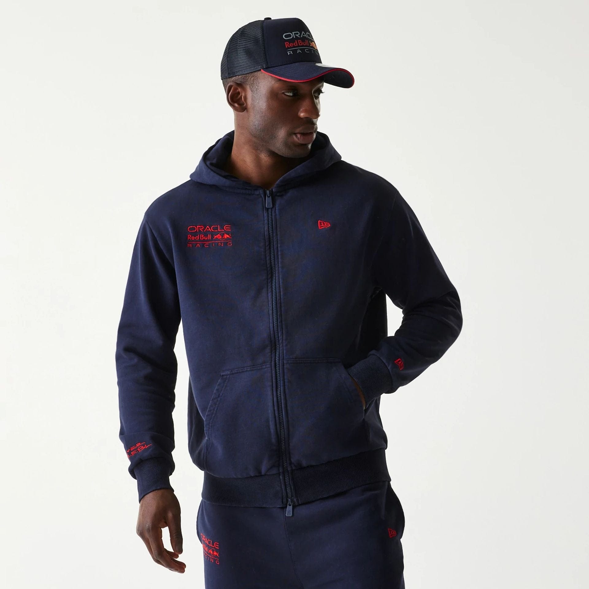 The Male model is wearing Red Bull Racing Dark Blue Oversized Full Zip Hoodie 1