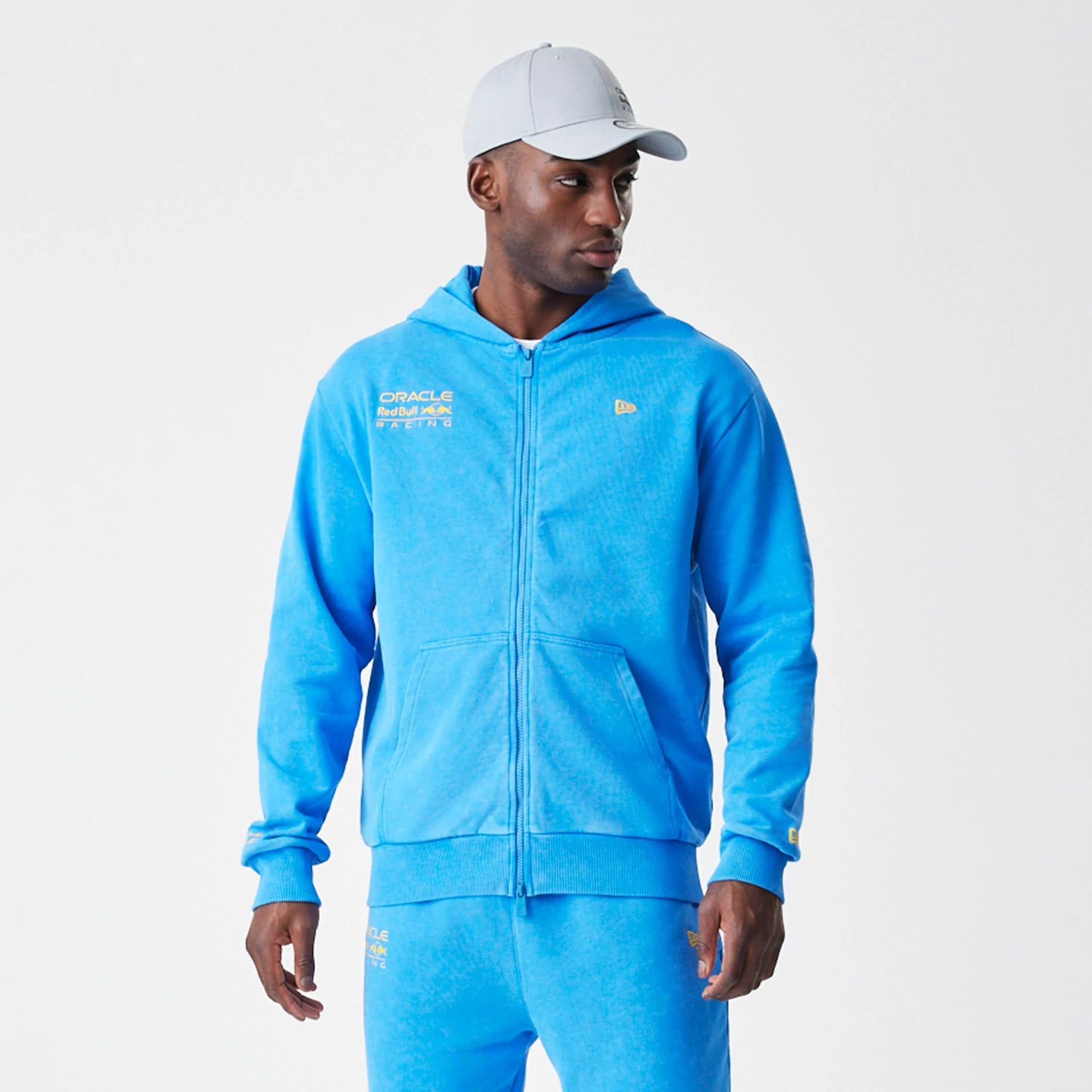The Male model is wearing Red Bull Racing Blue Oversized Full Zip Hoodie 1