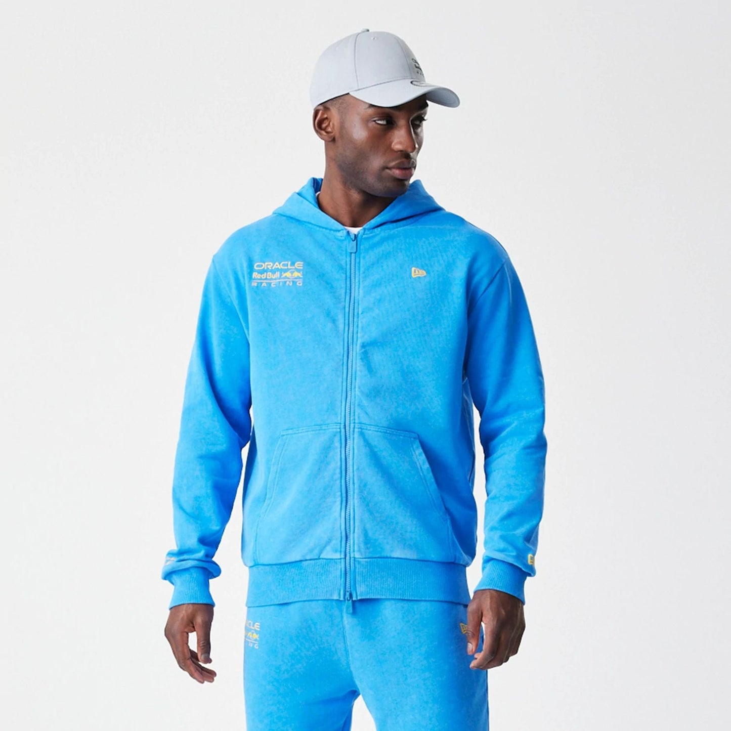 The Male model is wearing Red Bull Racing Blue Oversized Full Zip Hoodie 1
