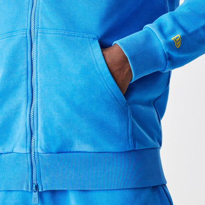 The Male model is wearing Red Bull Racing Blue Oversized Full Zip Hoodie 4