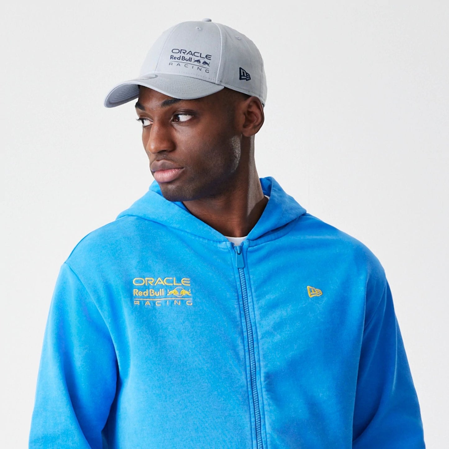 The Male model is wearing Red Bull Racing Blue Oversized Full Zip Hoodie 6