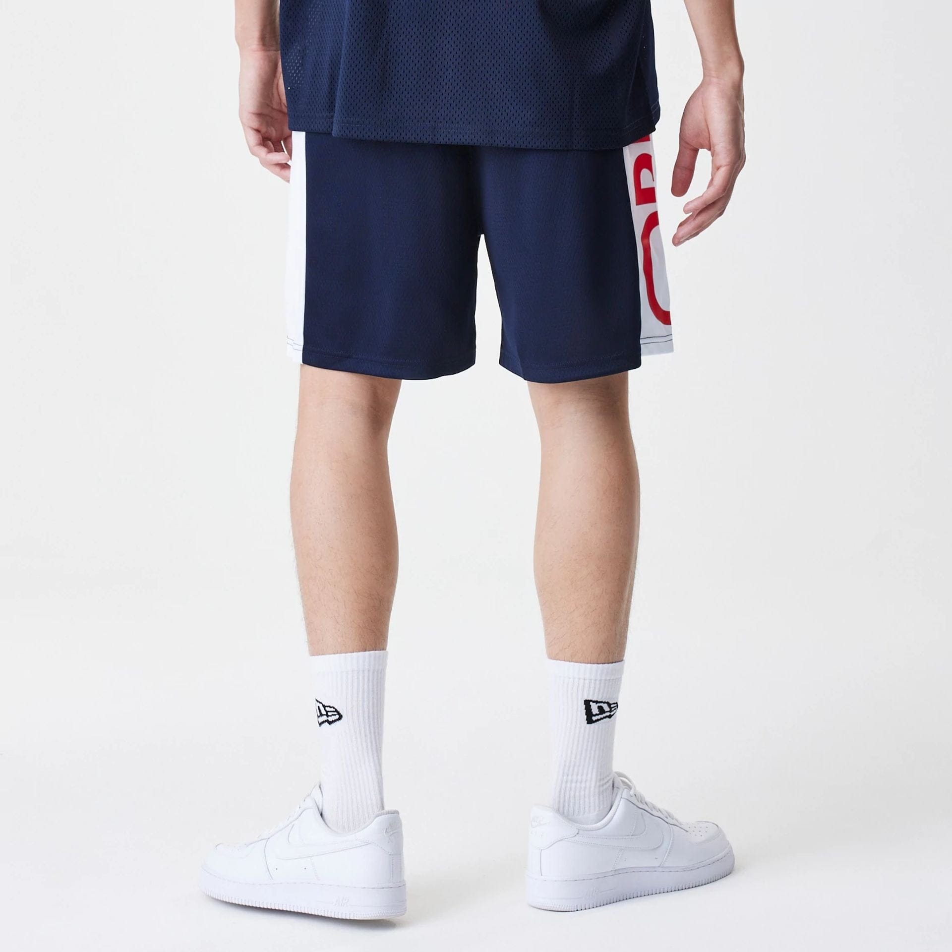 The Male model is wearing Red Bull Racing Graphic Mesh Dark Blue Shorts 2