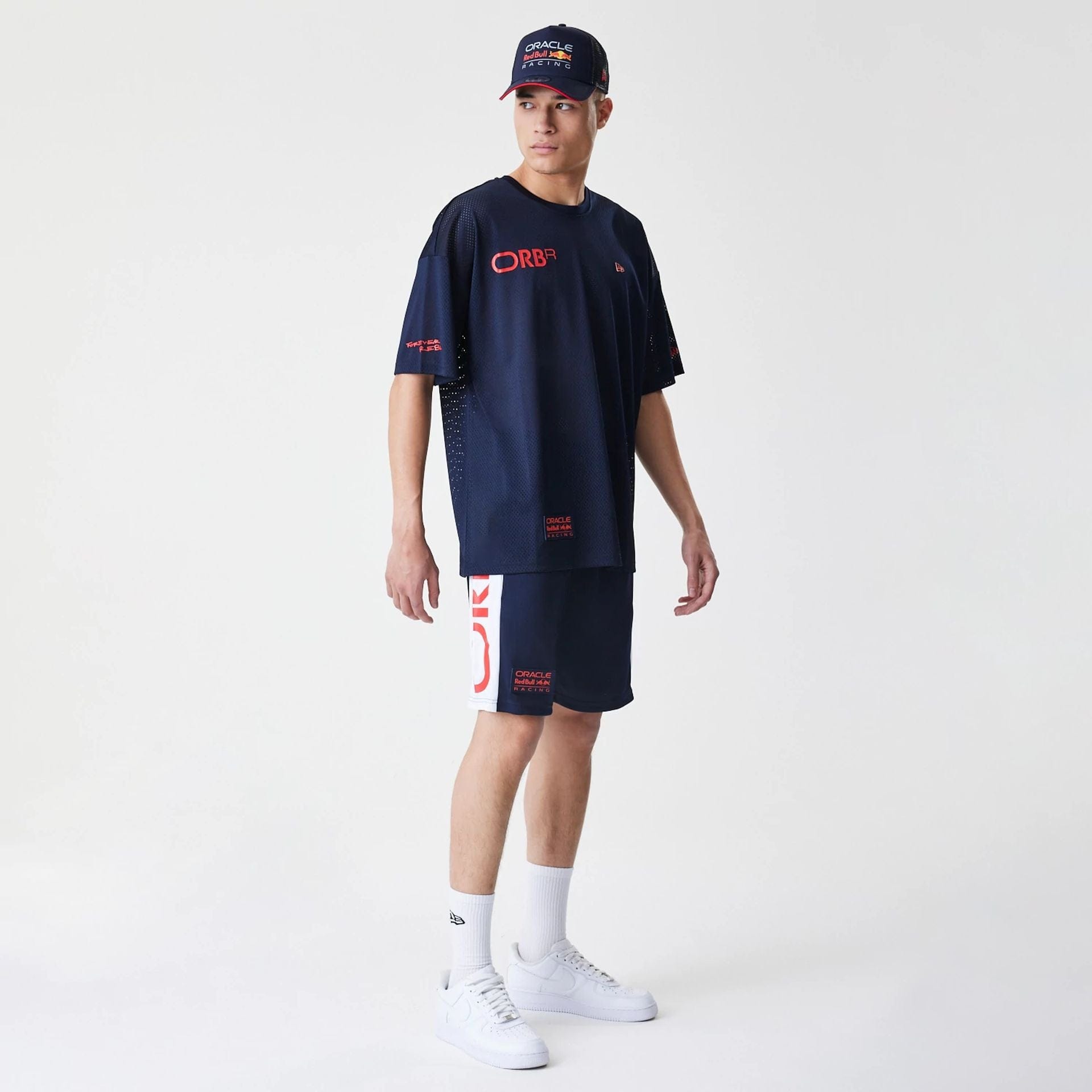 The Male model is wearing Red Bull Racing Graphic Mesh Dark Blue Shorts 8