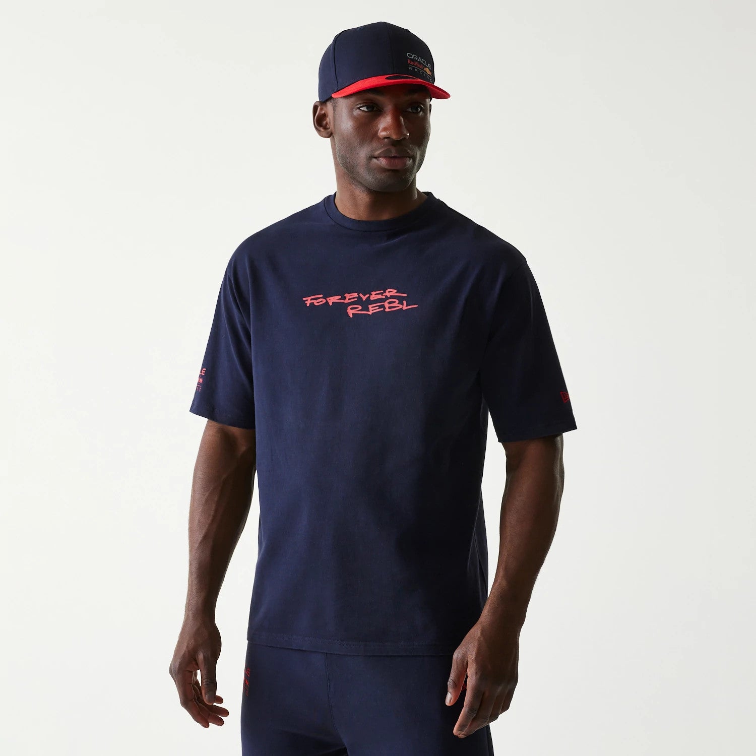 The Male model is wearing Red Bull Racing Back Graphic Dark Blue Oversized T-Shirt 1