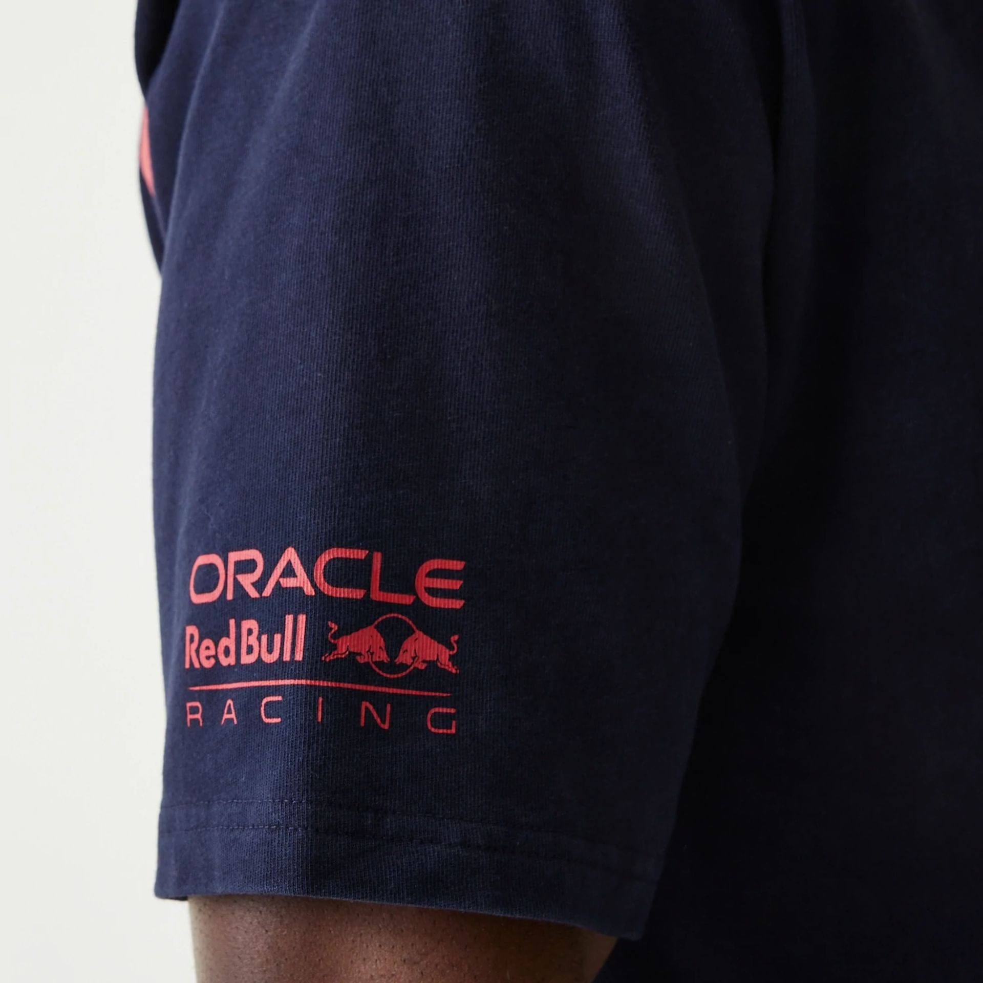 The Male model is wearing Red Bull Racing Back Graphic Dark Blue Oversized T-Shirt 5